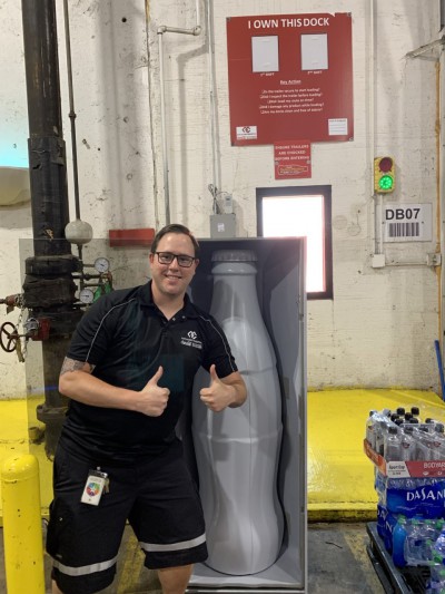 Warehouse Supervisor Alexander Hannah is excited to kick-off the Recognition Roadtrip with the official roving bottle at the Quapah facility on Oct. 25, 2021.