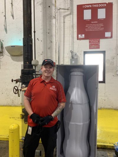 Jeremy Henley, Night Distribution Supervisor, with the Recognition Roadtrip Bottle at the Quapah facility on Oct. 25, 2021.