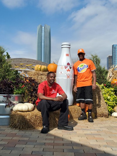 Jerome Hill & Ricky Young (left to right) from the May Avenue Warehouse in front of Oklahoma City’s tallest building, Devon Tower, on Oct. 20, 2021.