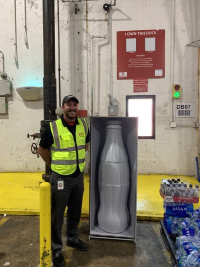 Stephen Johnson, Warehouse Manager 2, with the Recognition Roadtrip Bottle at the Quapah facility on Oct. 25, 2021.