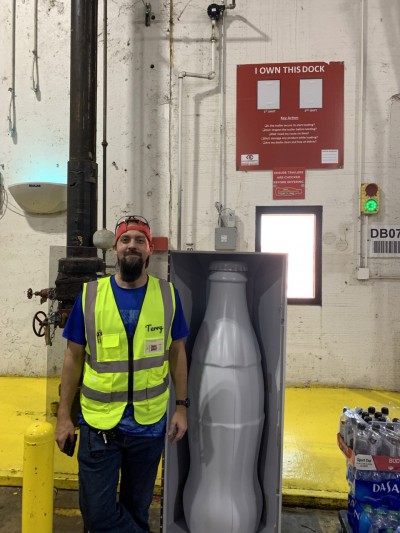 Terry Hittsman, Warehouse Forklift Driver, with the Recognition Roadtrip Bottle at the Quapah facility on Oct. 25, 2021.