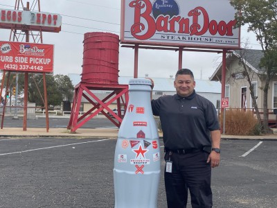 Jesse Quezada, Area Sales and Merchandising Manager, outside the legendary Barn Door Steakhouse. The Barn Door was opened 1963, and the building was originally a railway stop that dates all the way back to 1893.