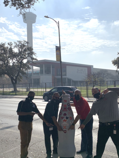 San Antonio heroes in front of the Henry B. Gonzalez Convention Center with the Recognition Roadtrip Bottle on Dec. 31, 2021. The convention center hosts over 300 events a year and its "Stars at Night" ballroom is the largest ballroom in Texas at 54,000 square feet.