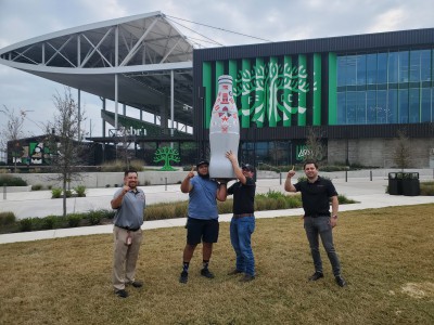 Austin heroes with the Recognition Roadtrip Bottle outside Q2 Stadium on Dec. 30, 2021. Built in 2019, Q2 Stadium is home to Austin FC and has a total capacity of 20,500 fans.