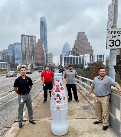 Austin heroes say “goodbye” to the Recognition Roadtrip Bottle by overlooking the beautiful skyline of downtown Austin.