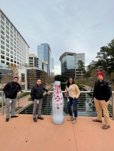Northpoint heroes with the Recognition Roadtrip Bottle at the Woodlands Waterway on Jan. 11, 2022. The Waterway is often called the “lifeblood of the city,” as it stretches from The Township to Lake Woodlands, connecting all the attractions along the way.