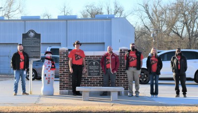 Paris heroes take the Recognition Roadtrip Bottle to the Paris CCSWB Sales Center on Feb. 15, 2022. On the Sales Center property, a State Marker commemorates the Hospital for Children and the Sanitarium of Paris McCuistion Community Hospital, which were formerly housed there. In fact, two CCSWB heroes were actually born in the hospital: Michael Flippen, Regional Sales Manager (second from the left) and Richie Huie, Northeast Director (not pictured). You could say they were born to be a part of the CCSWB team!