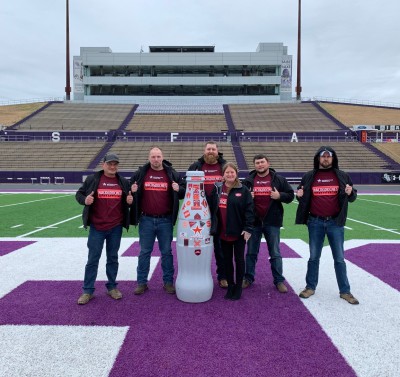 Touchdown! Nacogdoches heroes take the Recognition Roadtrip Bottle for a visit to the Homer Bryce Stadium at Stephen F. Austin State University on Jan. 20, 2022. Opened in 1973, the stadium is home to the university’s Lumberjacks football team and Ladyjacks and Lumberjacks track and field teams.