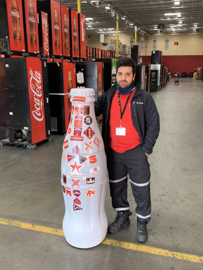 EFC hero, Alejandro Correa, Forklift Operator, with the Recognition Roadtrip Bottle on Feb. 22, 2022.