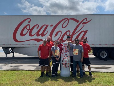 Corpus Christi heroes welcome the Recognition Roadtrip Bottle to their facility on March 14, 2022.