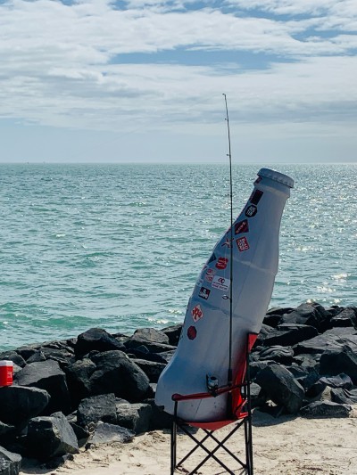 Gone fishin’! The Recognition Roadtrip Bottle takes an impromptu fishing trip at the beach on March 14, 2022.