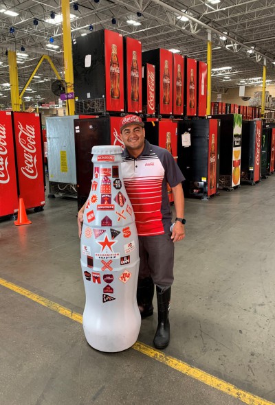 EFC hero, Oscar Lopez, Fountain Technician, with the Recognition Roadtrip Bottle on Feb. 22, 2022.