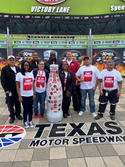 Fort Worth heroes with the Recognition Roadtrip Bottle in Victory Lane at Texas Motor Speedway on March 22, 2022.